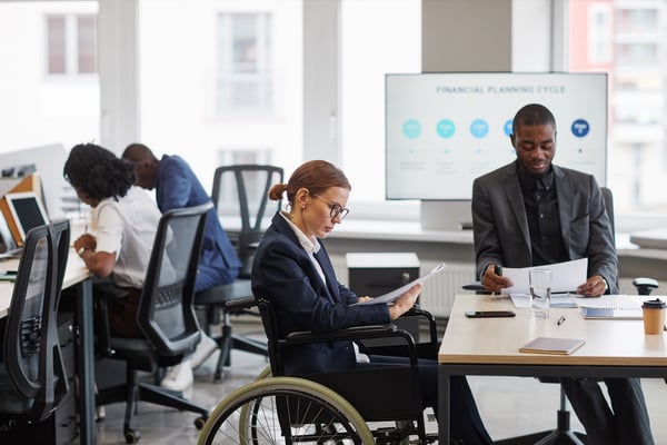 businesswoman-using-wheelchair-side-view-2022-01-27-21-00-32-utc