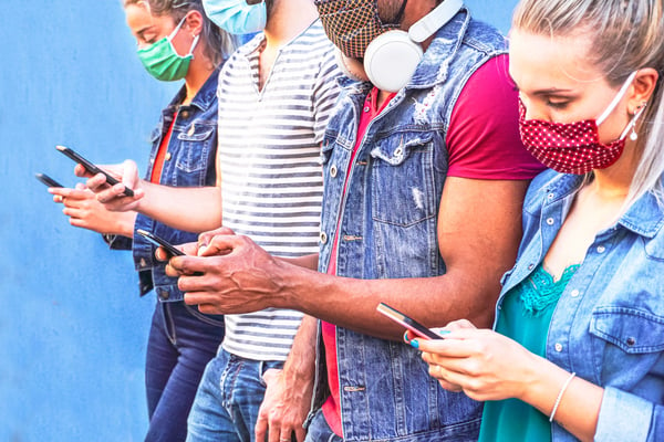 group-of-people-using-their-smartphones-in-coronav-2022-02-03-03-16-20-utc