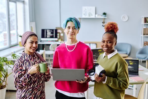 multiethnic-creative-team-smiling-at-camera-standi-2023-11-27-05-25-41-utc