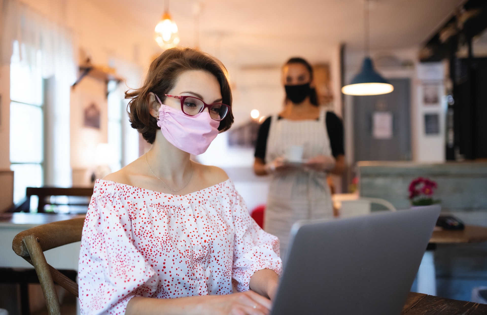 young-woman-with-face-mask-and-laptop-indoors-in-c-WBWWXGA