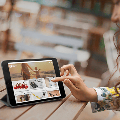 mockup-of-a-pretty-girl-sitting-on-outdoor-patio-using-a-black-ipad (1)-1
